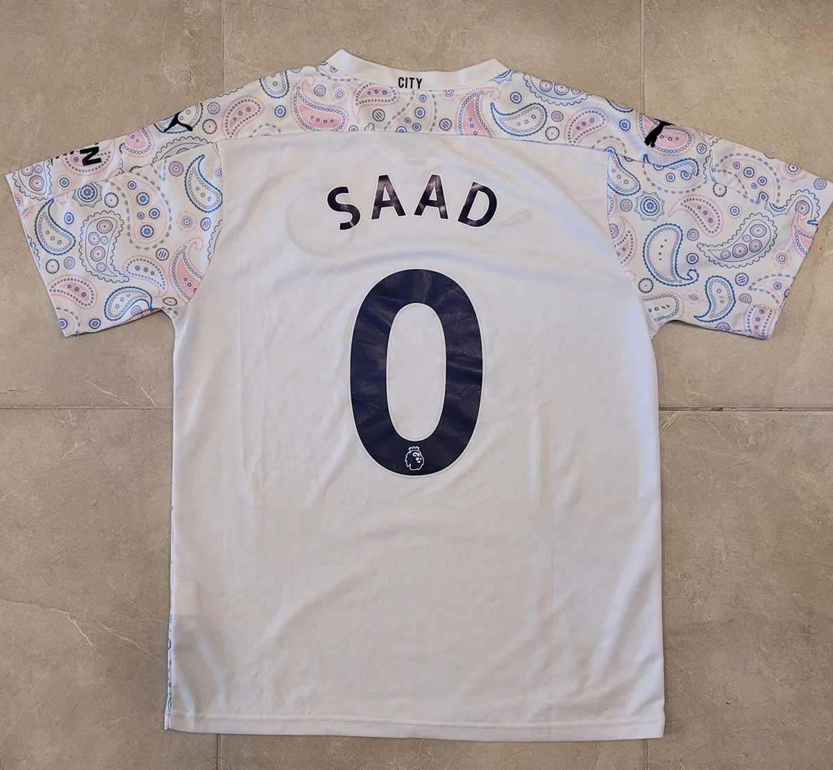 soccer jersey with the name saad and number 0 on the back